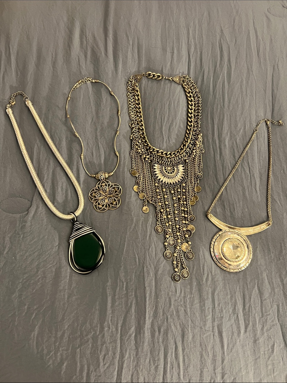 Four silvertone statement necklaces